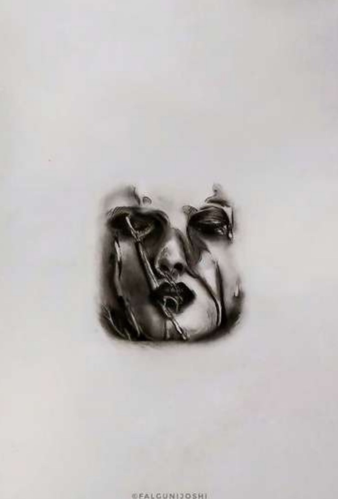 Charcoal drawing of a face surfacing from blank paper, its eyes and mouth overlaid with dark glossy liquid-like streaks that drip down the cheeks.