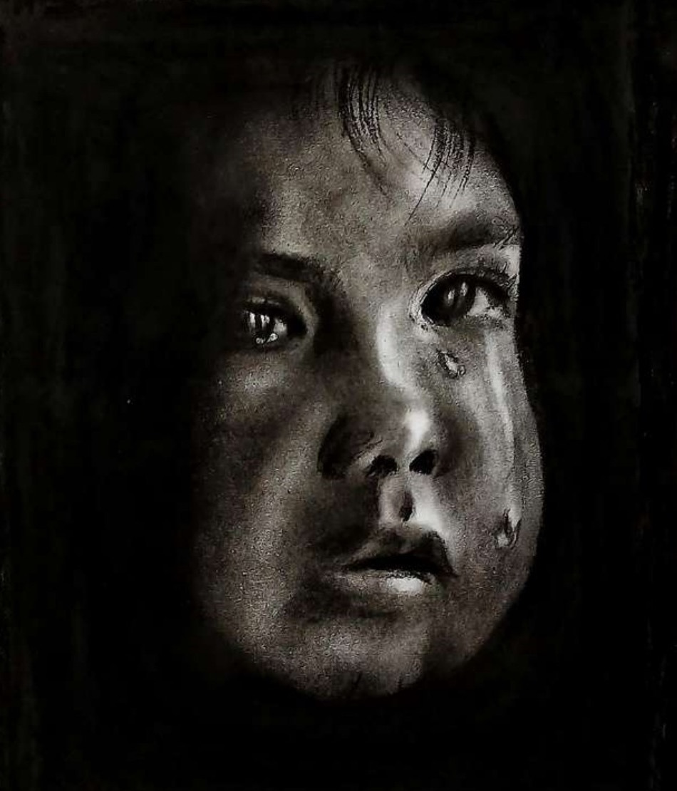 Close-up of a crying child's upturned face lit from one side, tears on the cheek, surrounded by deep black shadow.